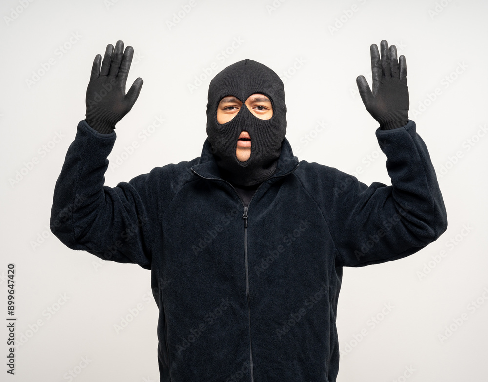 Thief in uniform black jacket various pose on isolated background. The Robber terrorism criminal escapes with balaclava and crowbar entering a house for stealing Housebreak
