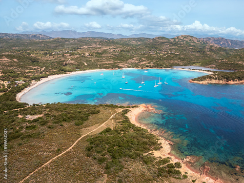 Aerial view of yachts moored in the turquoise Mediterranean sea at the bay of Rondinara on the island of Corsica photo