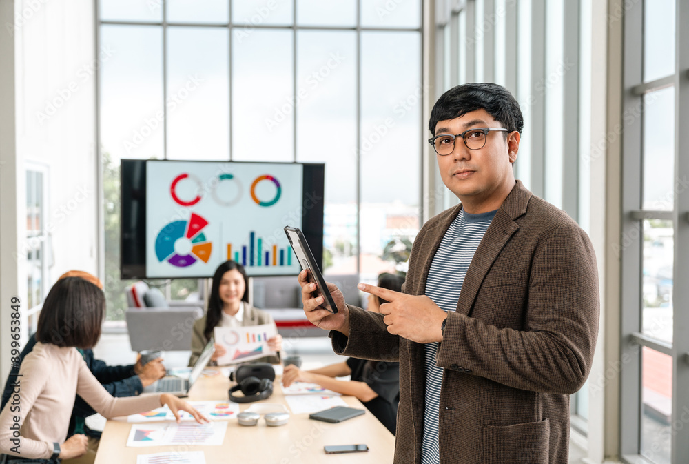 Fototapeta premium Asian business start up freelance people team analyzing statistics financial. Group Team of businesspeople man and woman Meeting Conference Discussion various topic Corporate Concept in office.