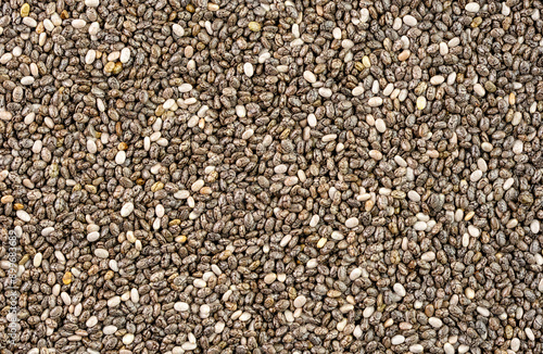 фотографія Numerous dried or dehydrated chia seeds spread evenly