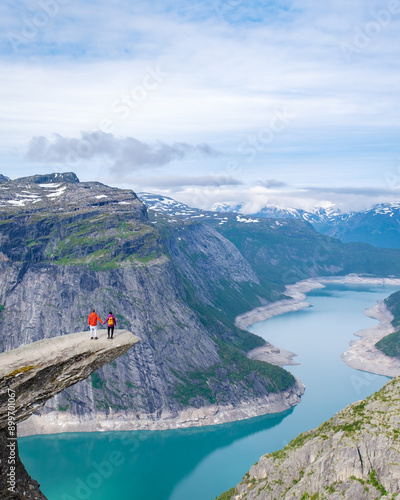 Couple on a Cliffside in Norway, Trolltunga, Norway photo