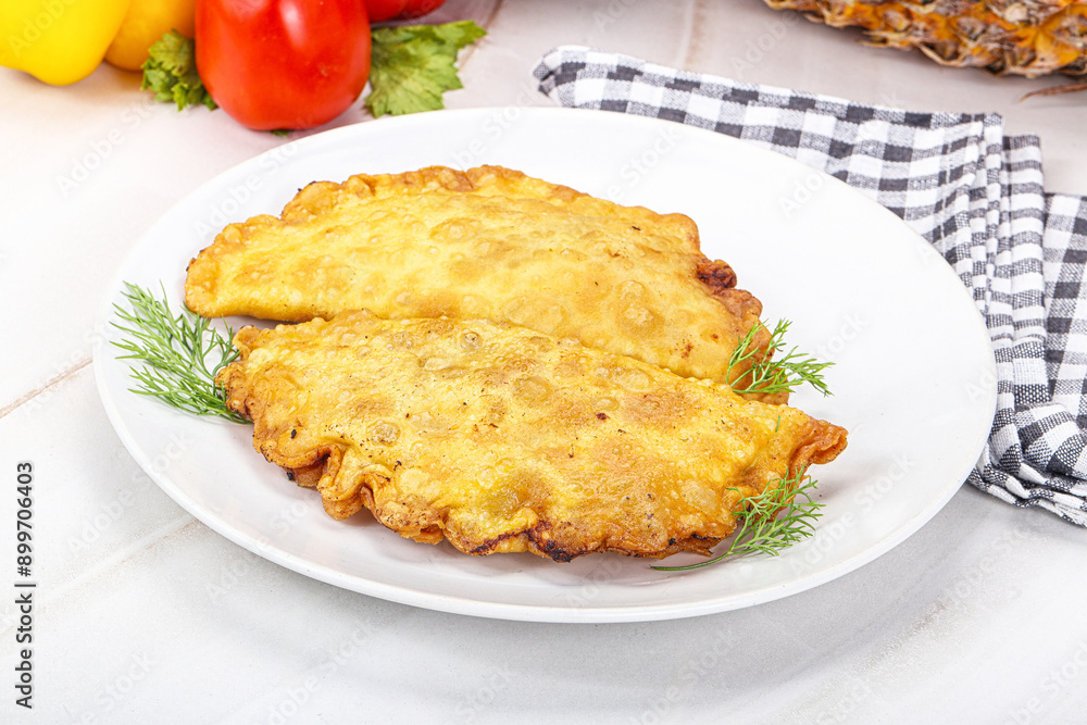 Homemade fried cheburek with meat Homemade fried cheburek with meat