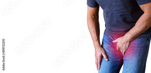 Pain in the groin, the man covered his groin with his hands. The focus of inflammation is marked in red. Space for copying.