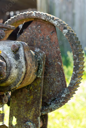 close up of an rusty agriculture gear and motor agriculture