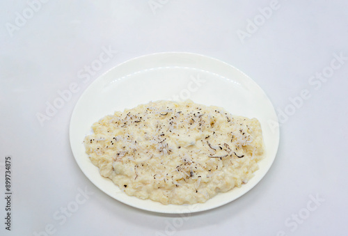 A Plate of Rice Pudding Kheer Khir Coconut Milk Rice Shrawan 15 Khir Khane Din with Coconut Powder photo