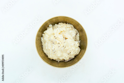 A Bowl of Rice Pudding Kheer Khir Coconut Milk Rice Shrawan 15 Khir Khane Din with Coconut Powder photo