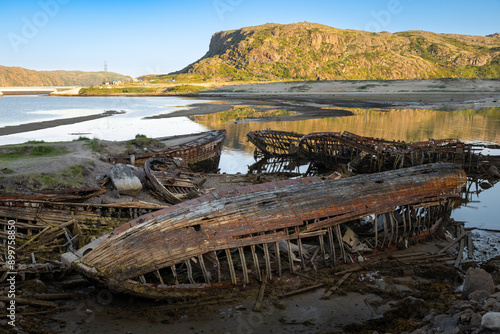 the cemetery of old ships on the seashore in the village of Teriberka, Murmansk region