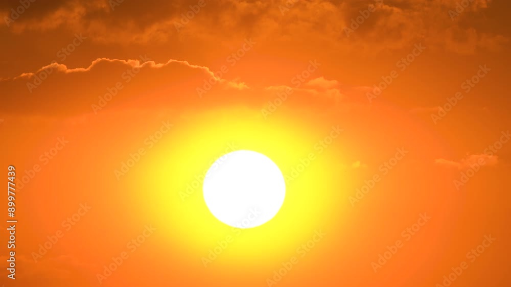 Big Sun with Clouds sunset. Dramatic sunset with orange sky in a sunny day. Big Sun with Clouds sunset. Dramatic sunset with orange sky in a sunny day.