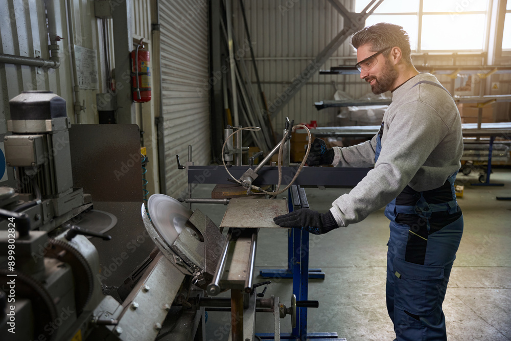 Professional cuts an aluminum profile in a window production Professional cuts an aluminum profile in a window production