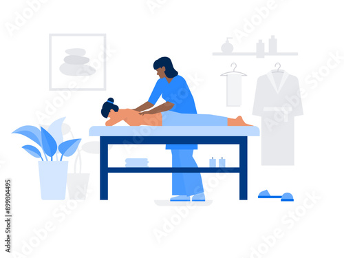 Masseuse giving back massage to woman
