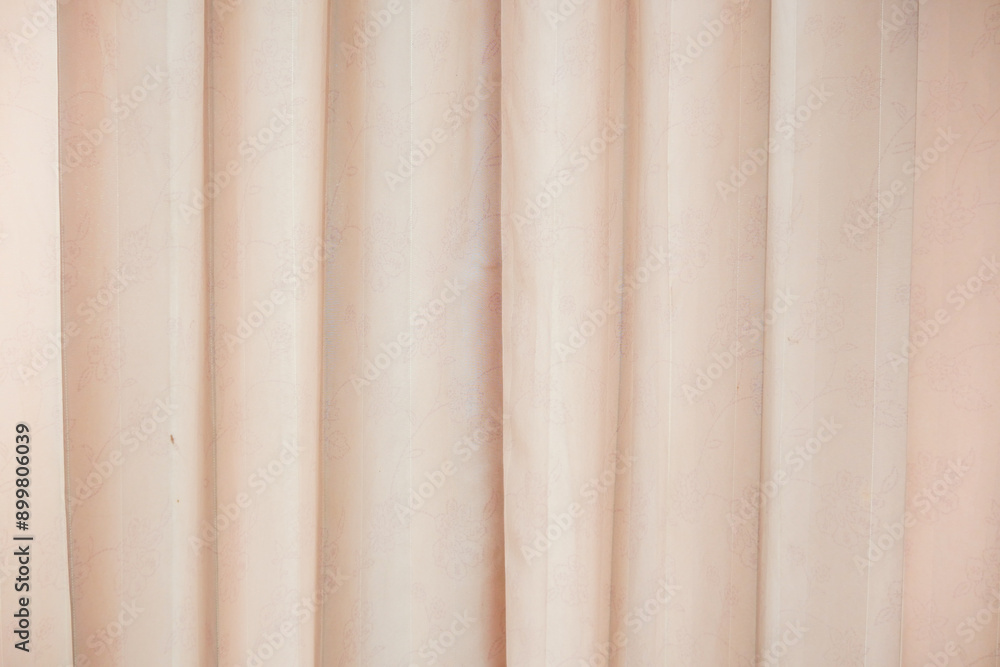 Fototapeta premium Cream-colored curtains with a detailed floral pattern.
