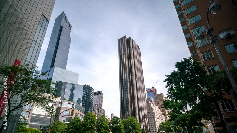 Looking up to Tall Skyscrapper reflecting light and clouds Looking up to Tall Skyscrapper reflecting light and clouds