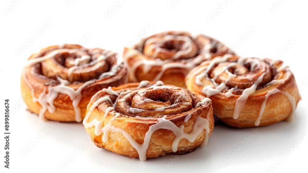 Freshly Baked Cinnamon Rolls with Icing Drizzle on White Background for Snack or Dessert Concept