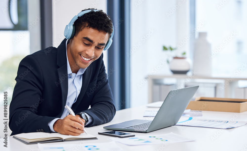 Notebook, laptop and businessman with headphones writing notes for company budget planning. Computer, research and male financial advisor listening to money investment podcast for advice in workplace Notebook, laptop and businessman with headphones writing notes for company budget planning. Computer, research and male financial advisor listening to money investment podcast for advice in workplace