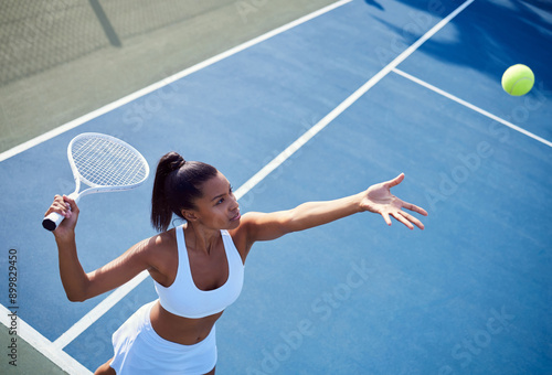 Fototapeta Naklejka Na Ścianę i Meble -  Woman, racket and tennis ball or aim or playing, fitness and training in summer exercise with equipment. Energy, match and competition challenge, active and practice for sport game or workout