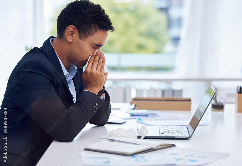 Sick, tissue and businessman in office blowing nose for flu, cold and sinus infection. Laptop, sneeze and male corporate attorney with virus or hayfever, allergies or congestion in workplace. Sick, tissue and businessman in office blowing nose for flu, cold and sinus infection. Laptop, sneeze and male corporate attorney with virus or hayfever, allergies or congestion in workplace.