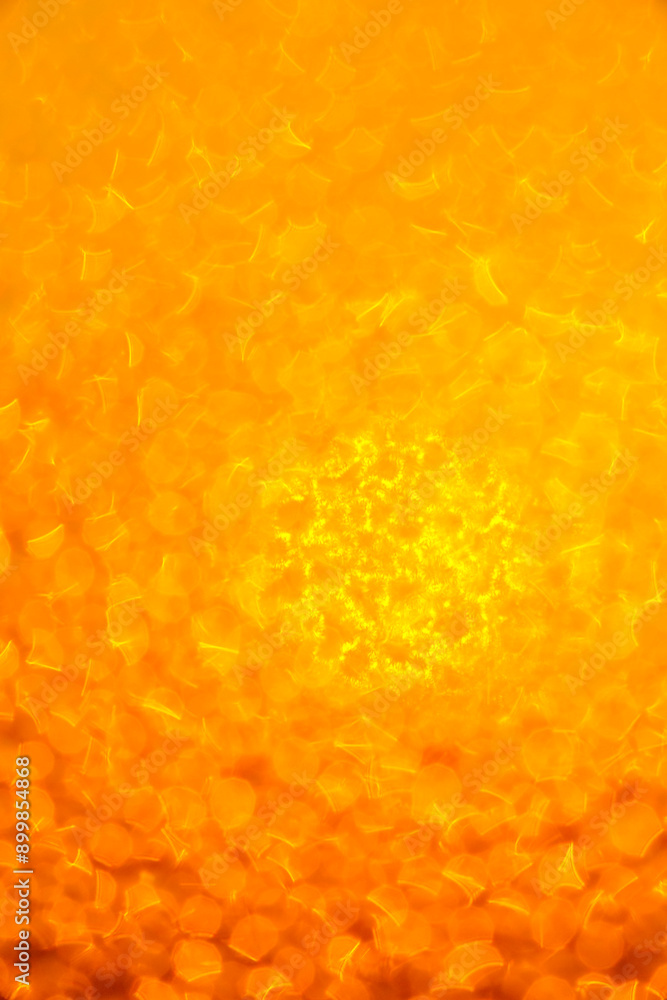 orange natural background: view on sunshine through frozen window orange natural background: view on sunshine through frozen window