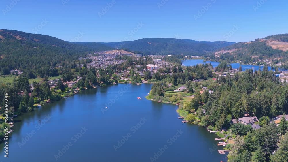 Aerial Glen lake overlooking Langford and distant mountain development on Vancouver Island in Canada Aerial Glen lake overlooking Langford and distant mountain development on Vancouver Island in Canada