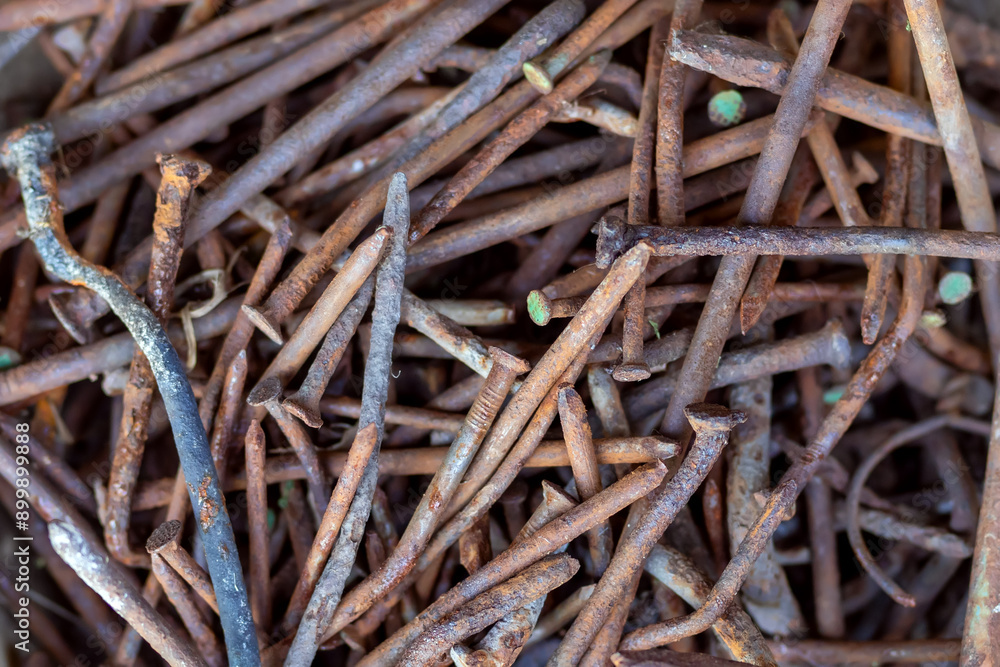 Pile of old Rusty nails close-up. Background old rusty steel nails. metal corrosion. Pile of old Rusty nails close-up. Background old rusty steel nails. metal corrosion.