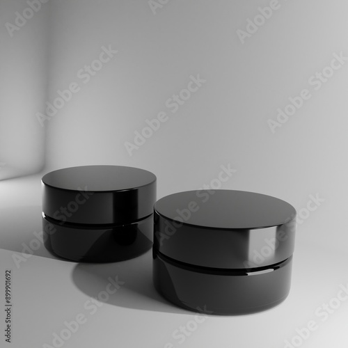 Cuadro en lienzo Two sleek black cosmetic jars stand on a pristine white background, illuminated by soft lighting