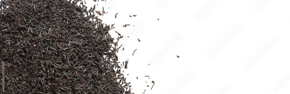 Black long tea on a white background. Top view of dried tea leaves. Tea composition. Ingredients for a hot drink, close-up. Background. Presentation of the type and variety of tea Black long tea on a white background. Top view of dried tea leaves. Tea composition. Ingredients for a hot drink, close-up. Background. Presentation of the type and variety of tea
