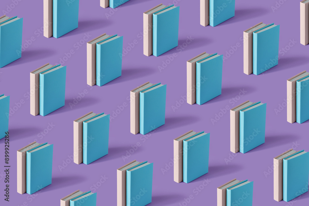 Pattern of two color books on a pastel purple background with soft shadow, copy space. Book Lovers Day concept Pattern of two color books on a pastel purple background with soft shadow, copy space. Book Lovers Day concept