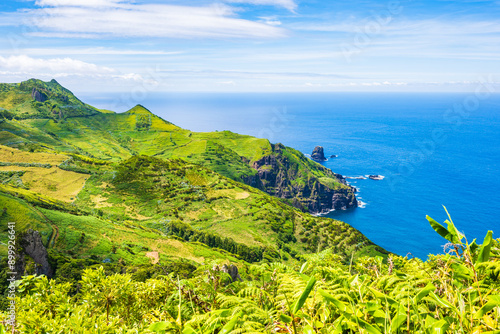 Green mountains, hills and ocean view between Faja Grande and Fajazinha villages, Flores island, Azores, Portugal photo