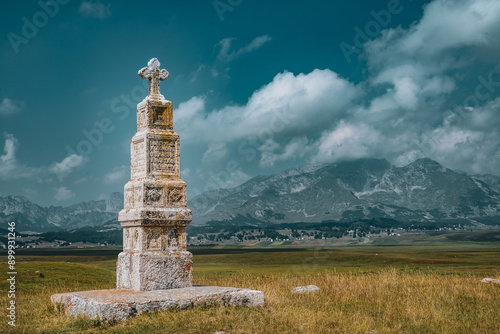 old tomb stone in mountains 