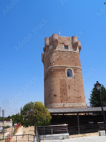 Brick tower of the Castle of Arroyomolinos, in Madrid, Spain, with cannonball impacts photo