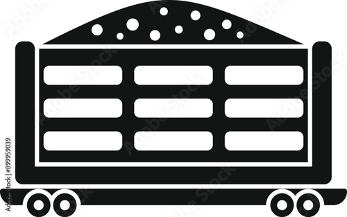 Black silhouette of a freight wagon transporting bulk cargo on railroad tracks