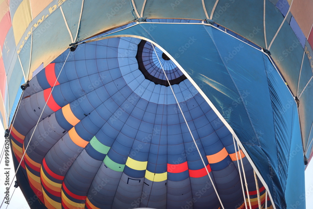 Obraz premium Colorful hot air manned balloon at sunrise 