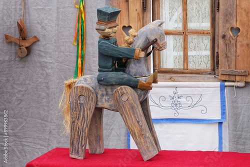 An old Polish folk wooden toy depicting an uhlan on a horse. photo