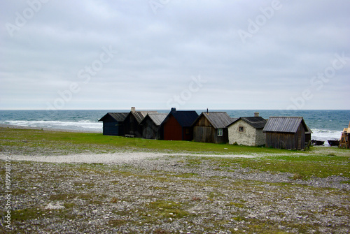 Small fisherman's cottages in a row at an ancient fishing village at the Baltic Sea on the Swedish island Fårö in autumn. 