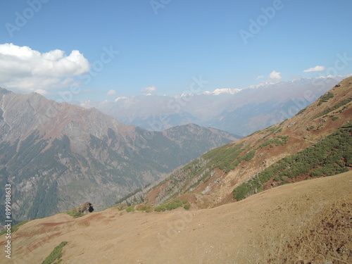 Aerial panorama of the Himalayas during a paragliding flight from Bir Billing to Dharamsala, Himachal Pradesh, India. Stunning mountain views in the heart of the Himalayas.