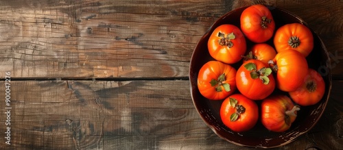 Bowl of autumn persimmons o...