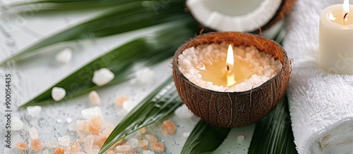 A coconut candle on a green...