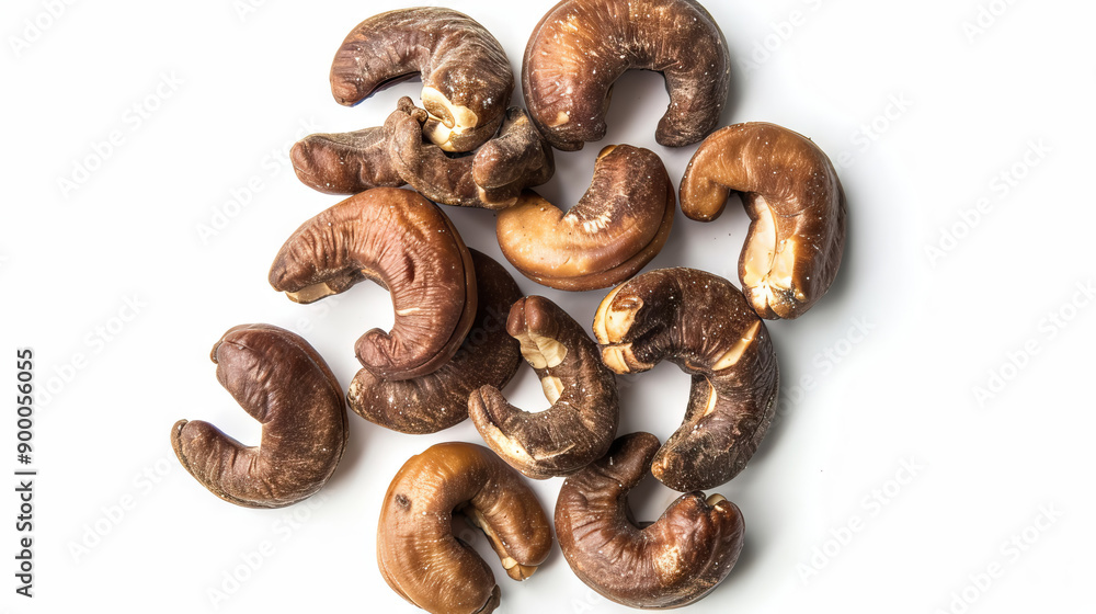 top view flat lay roasted sea salt cashew nuts - Anacardium occidentale - whole and halve on white background with copy space. top view flat lay roasted sea salt cashew nuts - Anacardium occidentale - whole and halve on white background with copy space.