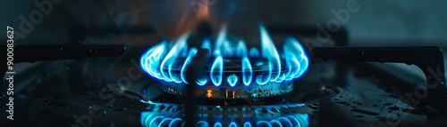 Blue flame on a gas stove burner, closeup, dark background, bright and intense lighting, focused and dynamic photo