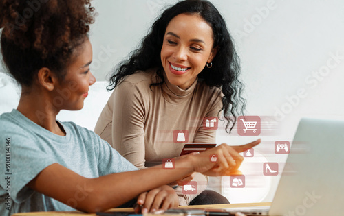 Elegant customer wearing gray shirt point laptop consulting smart brown shirt user holding credit card watching while open e-commerce application use cashless technology shopping inventory. Cybercash. photo