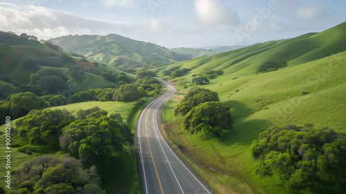 aerial view scenic road through a lush green valley surrounded by rolling hills trip through lush green countryside sunny day