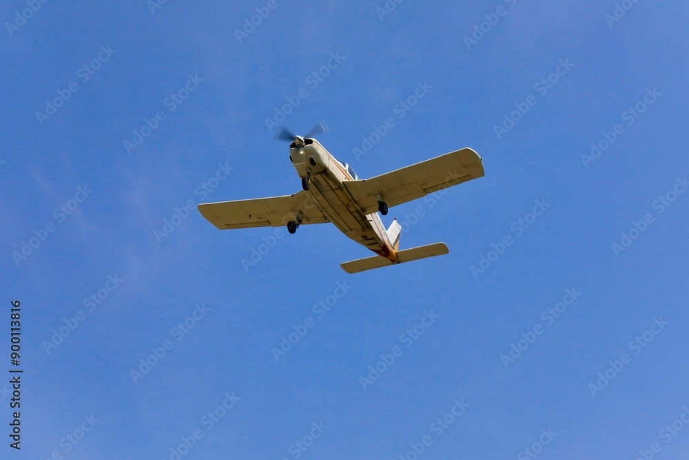 Single prop aircraft on a clear sky Single prop aircraft on a clear sky