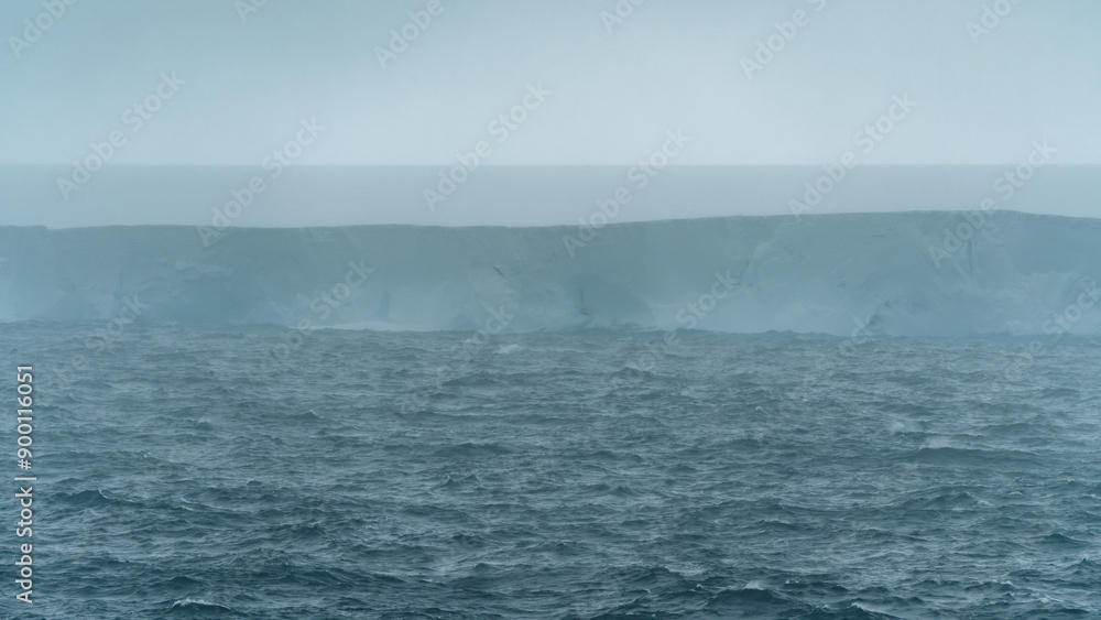 A23a Large Iceberg Antarctica Rough Seas Moody Clouds Fog and Dark Ocean. Ice Shelf Climate Change Scenic Cruise View A23a Large Iceberg Antarctica Rough Seas Moody Clouds Fog and Dark Ocean. Ice Shelf Climate Change Scenic Cruise View