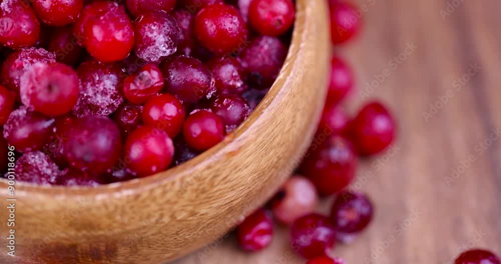 frozen red ripe cranberry berries on the table, sweet and sour quick-frozen cranberry harvest frozen red ripe cranberry berries on the table, sweet and sour quick-frozen cranberry harvest