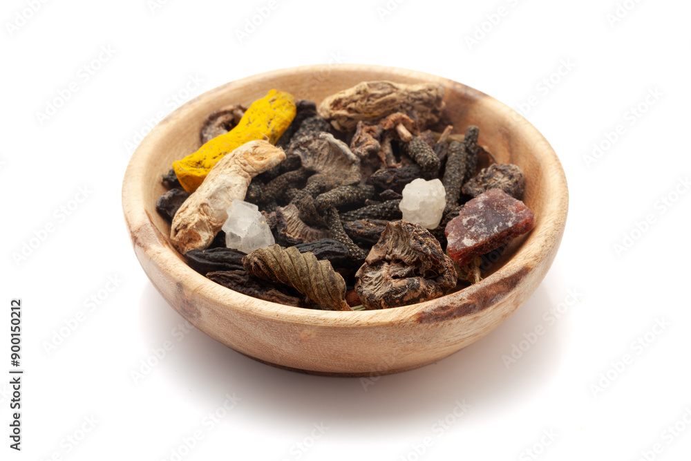 Front view of organic whole spices in a wooden bowl used to make a digestive powder called Front view of organic whole spices in a wooden bowl used to make a digestive powder called