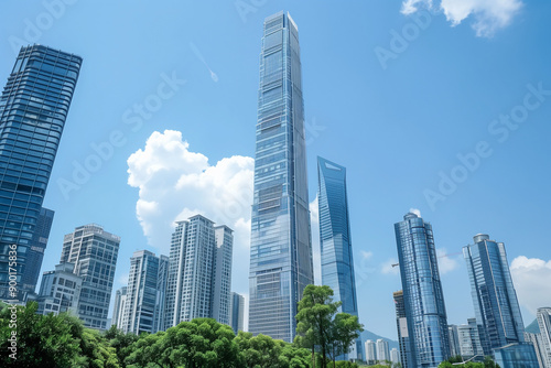 Skyscrapers Reaching into a Bright Blue Sky with White Clouds on a Sunny Day