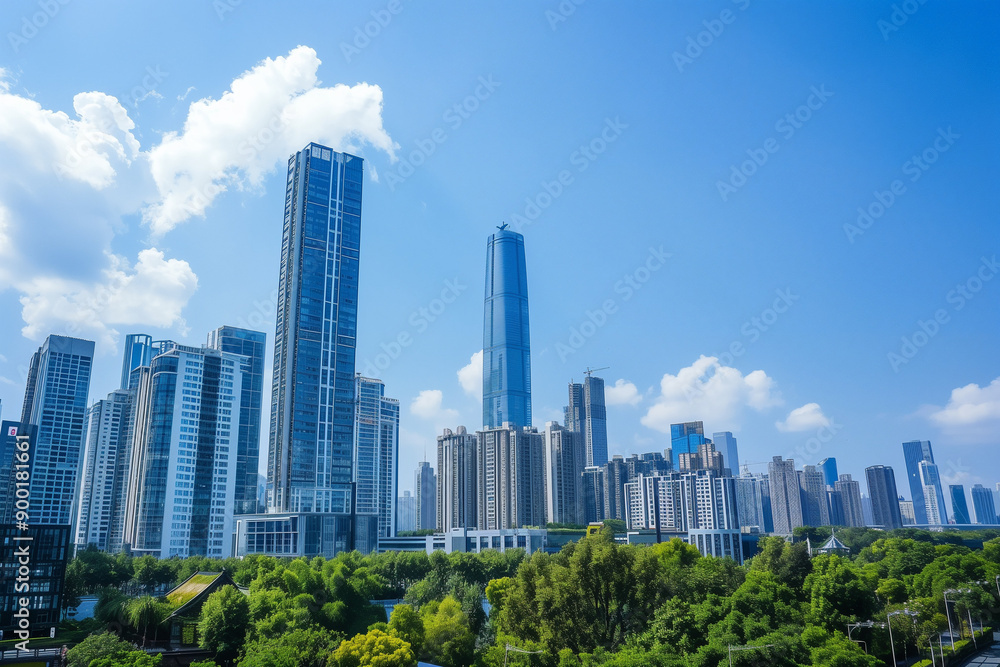 Skyscrapers Reaching into a Bright Blue Sky with White Clouds on a Sunny Day Skyscrapers Reaching into a Bright Blue Sky with White Clouds on a Sunny Day