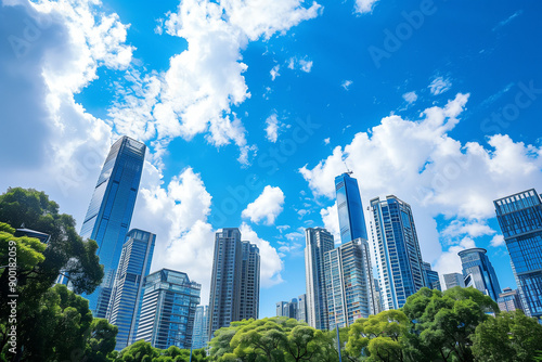 Skyscrapers Reaching into a Bright Blue Sky with White Clouds on a Sunny Day