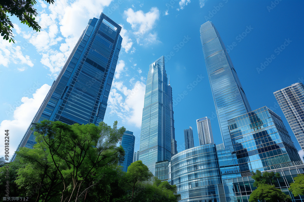Skyscrapers Reaching into a Bright Blue Sky with White Clouds on a Sunny Day Skyscrapers Reaching into a Bright Blue Sky with White Clouds on a Sunny Day