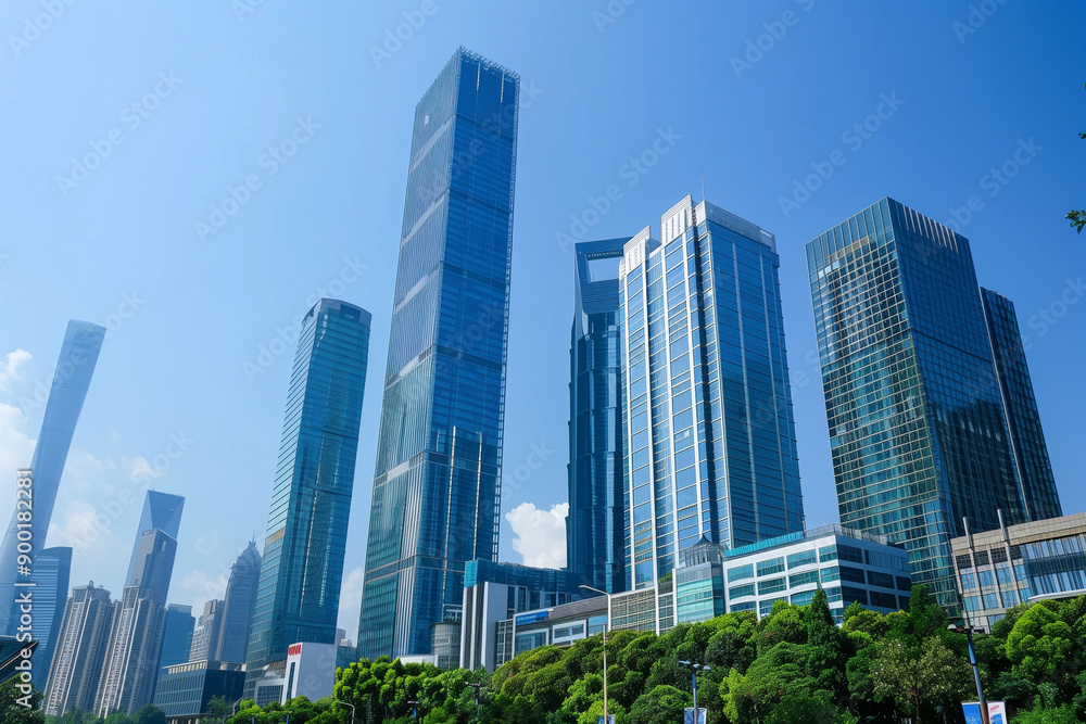 Skyscrapers Reaching into a Bright Blue Sky with White Clouds on a Sunny Day Skyscrapers Reaching into a Bright Blue Sky with White Clouds on a Sunny Day