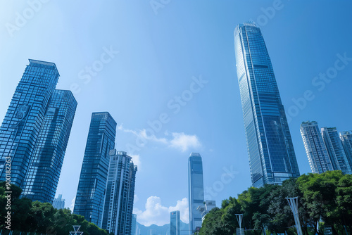 Skyscrapers Reaching into a Bright Blue Sky with White Clouds on a Sunny Day